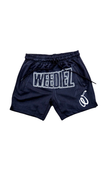 Front view of the basketball shorts with white weediez logo on center and embroidered “w” on left side leg