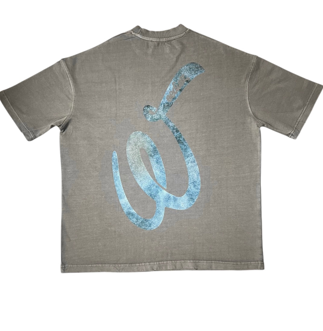 Back side view of the grey signature style T-shirt with a blue Weediez "W" colored distressed logo.