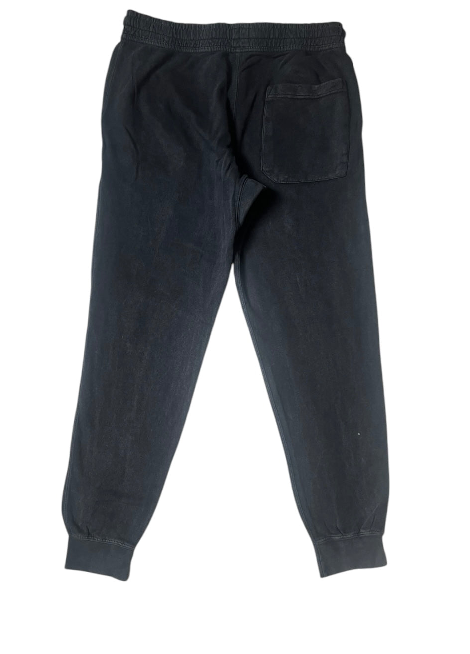Back view of the black signature style joggers with a right side square pocket 