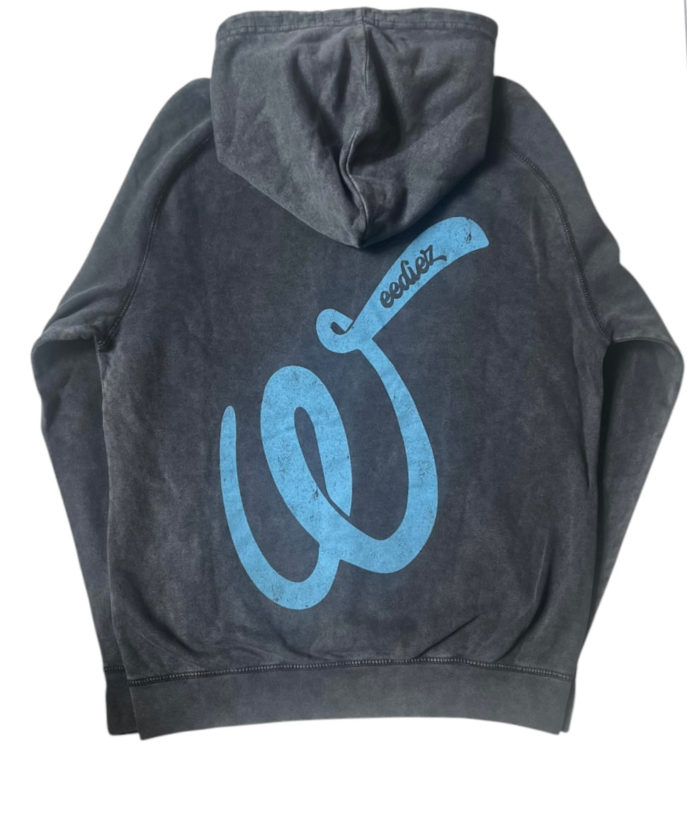 Back side view of the black signature style T-shirt with a light blue Weediez "W" colored distressed logo