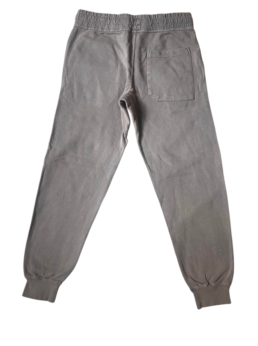 Back view of the grey signature style joggers with a right side square pocket 
