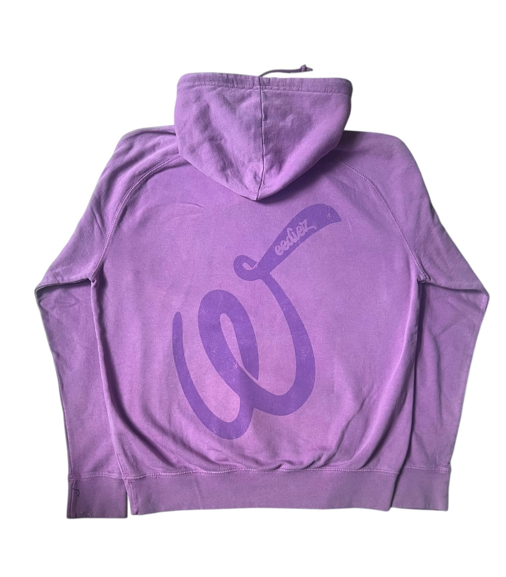 Back side view of the purple signature style T-shirt with a slightly darker purple Weediez "W" colored distressed logo