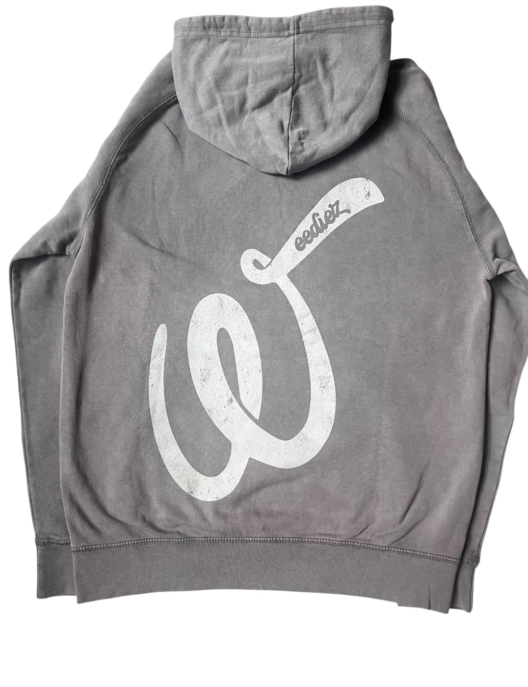 Back side view of the grey signature style T-shirt with a off-white Weediez "W" colored distressed logo